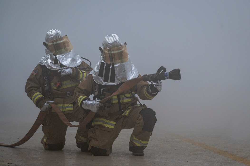 U.S. Air Force firefighters assigned to the 51st Civil Engineer Squadron extinguish a simulated fire during Beverly Herd 24-1 at Osan Air Base, Republic of Korea, May 13, 2024. The training during BH 24-1 provided 51st CES crew members the opportunity to apply knowledge and skills essential for contingency operations. Training is conducted throughout the year to generate combat airpower at a moment’s notice, affirming the commitment to the ROK remains ironclad and ensures regional stability throughout the U.S. Indo-Pacific Command. (U.S. Air Force photo by Senior Airman Sabrina Fuller-Judd)