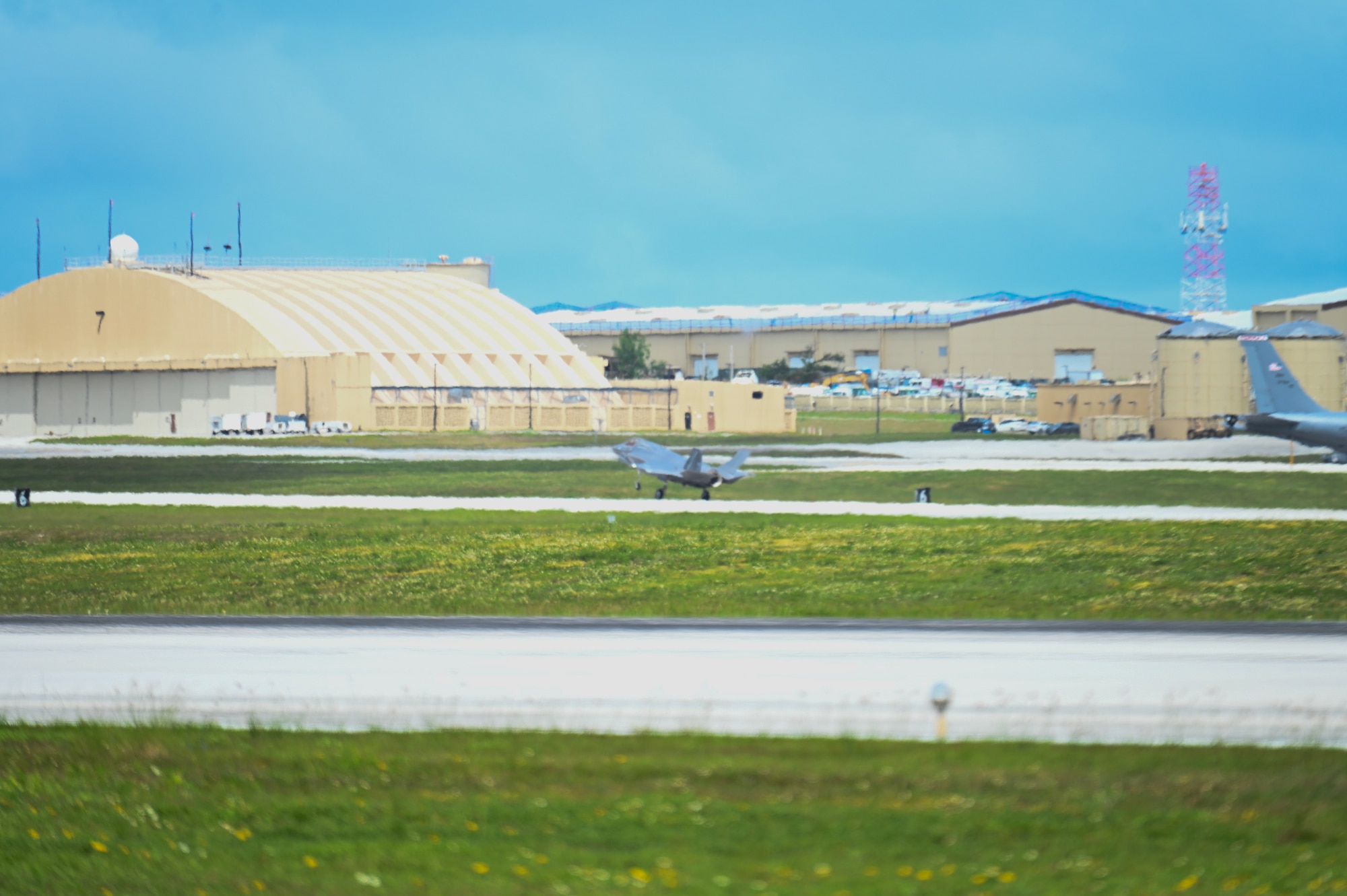 A U.S. Marine Corps F-35B Lightning II lands on a flightline.