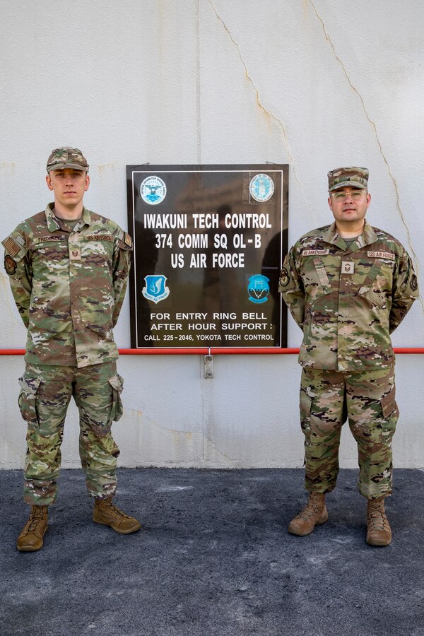 U.S. Air Force Tech Sgt. Joseph Fredrick Jr, left, a cyber defense operations airman, and a native of California, and Senior Master Sgt. William Blankenship, a communications site chief, and a native of Mississippi, both with 374th Communications Squadron Operating Location Bravo, 374th Communications Squadron, 374th Mission Support Group, pose for a photo at Marine Corps Air Station Iwakuni, Japan, April 19, 2024. (U.S. Marine Corps photo by Lance Cpl. David Getz)