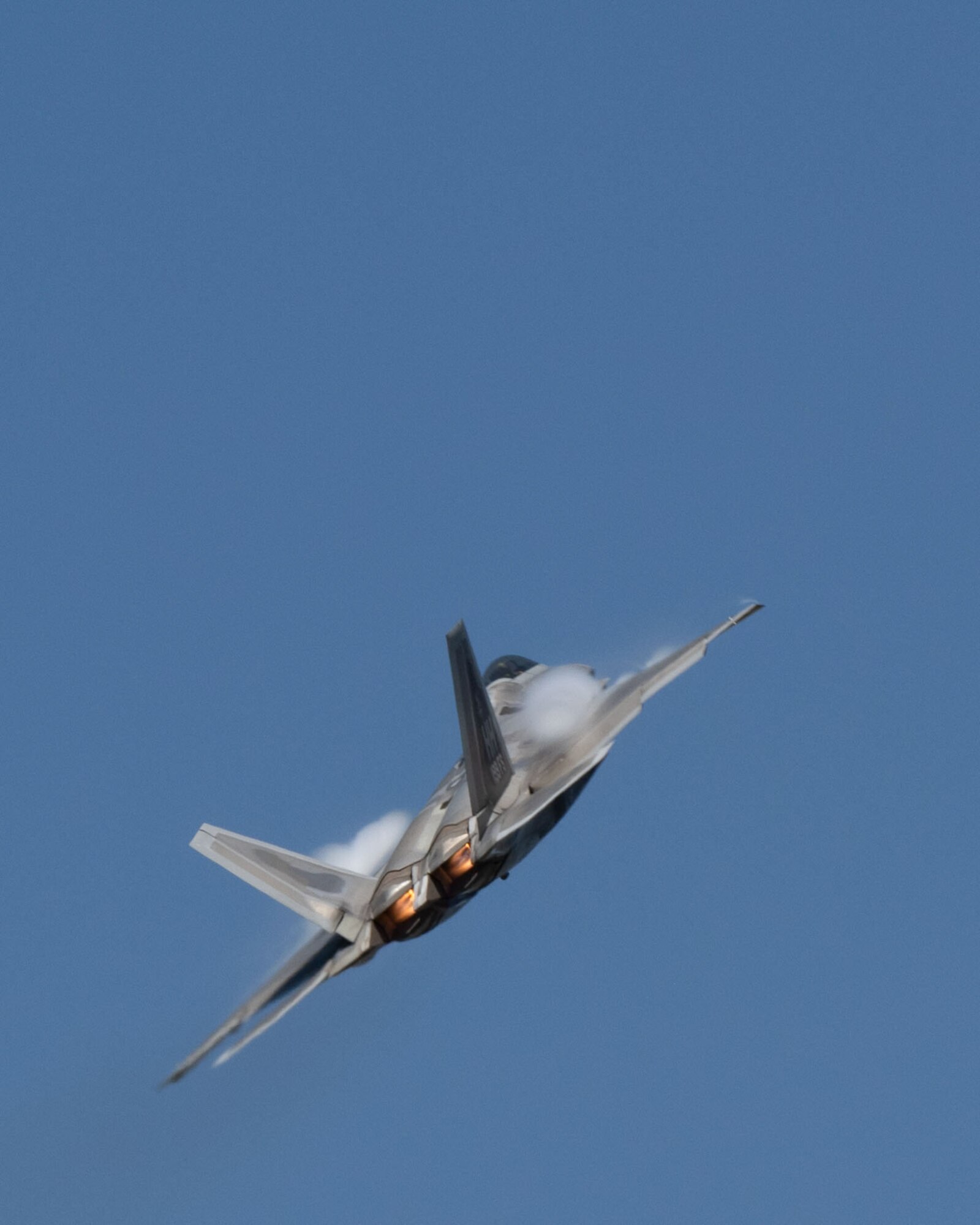 An F-22 Raptor, assigned to Joint Base Pearl Harbor-Hickam, flies over Kunsan Air Base.