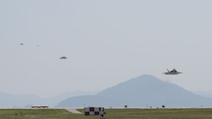 Four F-22 Raptor aircraft prepare to land at Kunsan Air Base.