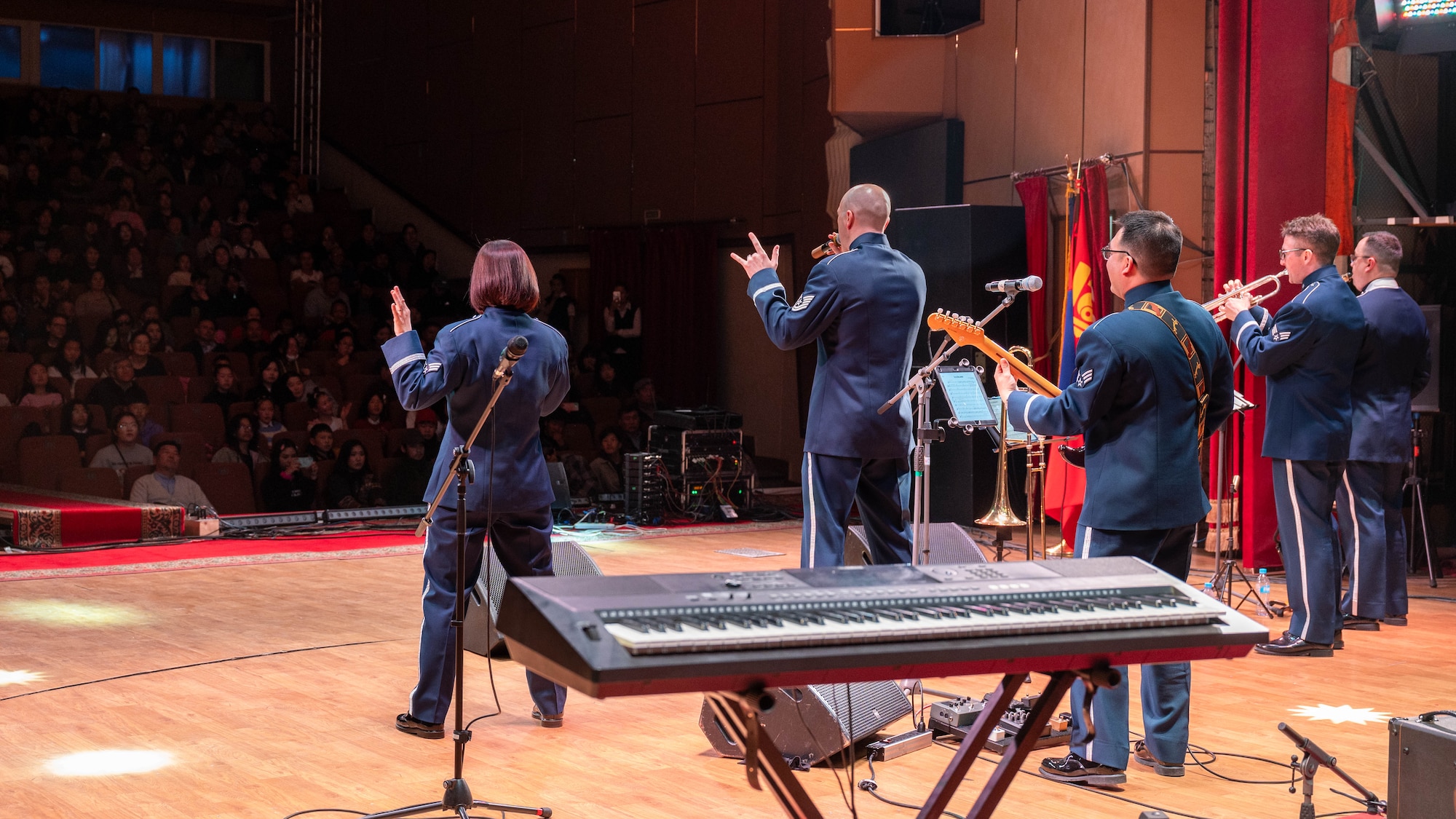 A band performs for an audience.