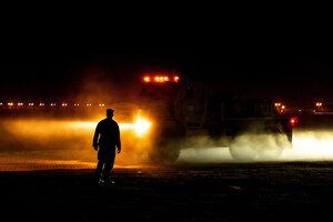 A U.S. Marine assigned to 2nd Marine Logistics Group watches a convoy arrive at an undisclosed location within the U.S. Central Command area of responsibility during Native Fury 24, May 10, 2024. NF 24 enhances interoperability with our partners while strengthening our ability to plan and execute operations across multiple domains. (U.S. Air Force photo by Airman 1st Class Alondra Cristobal Hernandez)