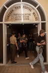 U.S. Marine Corps recruits with Hotel Company, 2nd Recruit Training Battalion, walk through a hatch during a receiving event at Marine Corps Recruit Depot San Diego, May 6, 2024. During the receiving process recruits are checked for contraband, given haircuts, allowed a phone call home, and are issued their gear required for training. (U.S. Marine Corps photo by Lance Cpl. Janell B. Alvarez)