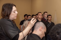 U.S. Marine Corps recruits with Hotel Company, 2nd Recruit Training Battalion, await haircuts during a receiving event at Marine Corps Recruit Depot San Diego, May 6, 2024. During the receiving process recruits are checked for contraband, given haircuts, allowed a phone call home, and are issued their gear required for training. (U.S. Marine Corps photo by Lance Cpl. Janell B. Alvarez)