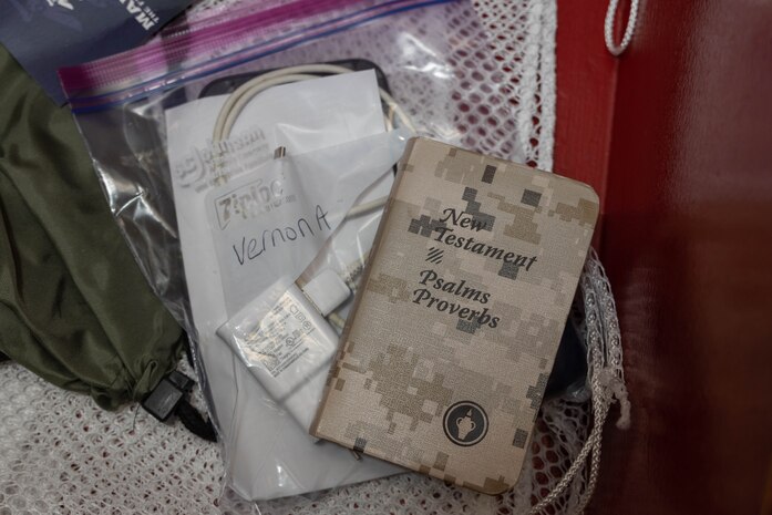 Belongings of a recruit with Hotel Company, 2nd Recruit Training Battalion, await inspection during a receiving event at Marine Corps Recruit Depot San Diego, May 6, 2024. During the receiving process recruits are checked for contraband, given haircuts, allowed a phone call home, and are issued their gear required for training.(U.S. Marine Corps photo by Lance Cpl. Janell B. Alvarez)