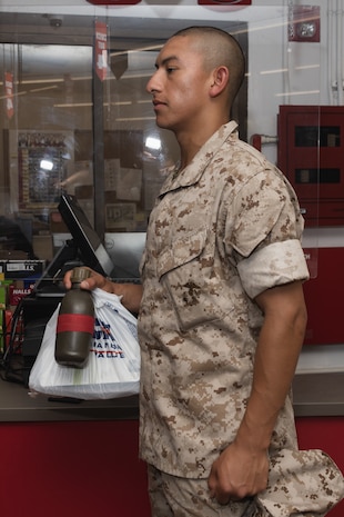 U.S. Marine Corps Recruit Aiden Higuera with Bravo Company, 1st Recruit Training Battalion, purchases items during a post exchange and haircut call at Marine Corps Recruit Depot San Diego, California, May 8, 2024. Recruits are allowed to go to the PX to purchase necessary supplies and receive haircuts weekly during their time at MCRD San Diego in order to maintain a uniform appearance and promote good hygiene throughout recruit training. (U.S. Marine Corps photo by Lance Cpl. Janell B. Alvarez)