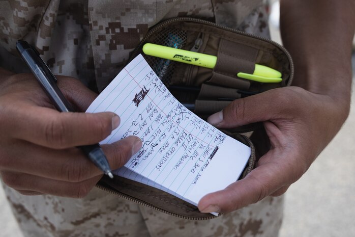 U.S. Marine Corps Recruit Adrian Pedraza with Bravo Company, 1st Recruit Training Battalion, takes notes during a post exchange and haircut call at Marine Corps Recruit Depot San Diego, California, May 8, 2024. Recruits are allowed to go to the PX to purchase necessary supplies and receive haircuts weekly during their time at MCRD San Diego in order to maintain a uniform appearance and promote good hygiene throughout recruit training. (U.S. Marine Corps photo by Lance Cpl. Janell B. Alvarez)