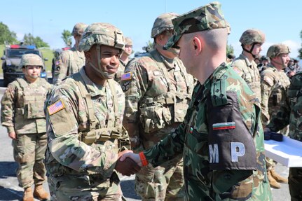 Capt. Eric Cheatham, operations officer for the 117th Military Police Battalion, Tennessee National Guard, meets Col. Dimitar Dimitrov with the Bulgarian Military Police Force during the opening ceremony of the multinational training exercise Beyond Horizon 2024 at Bulgaria’s Novo Selo Training Site, May 14. Nearly 20 Tennessee National Guard Soldiers from the 117th Military Police Battalion and 269th Military Police Company will train with more than 140 military police from Bulgaria, Canada, Greece, North Macedonia and Romania during the nine-day exercise.