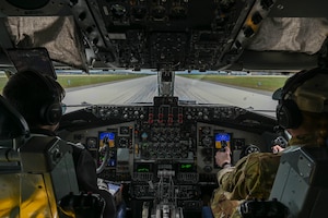 Pilots in a KC-135 Stratotanker takeoff.