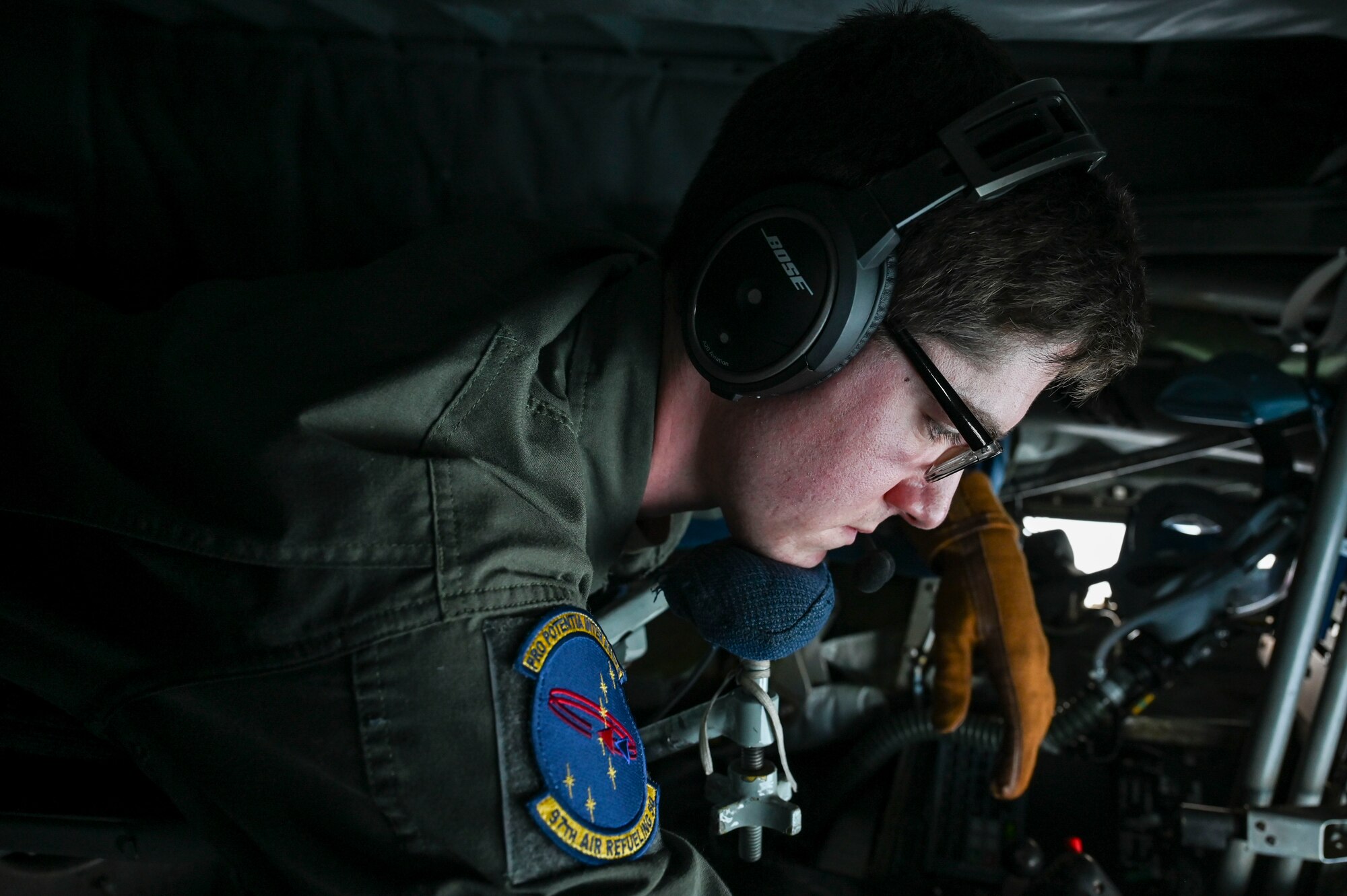 An Airman sits in the boom pod of a KC-135 Stratotanker.
