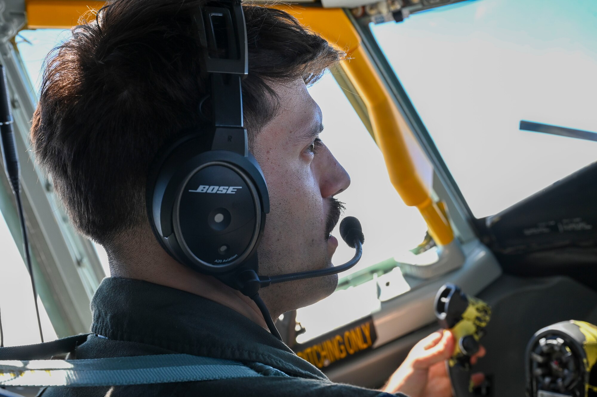 A pilot flies a KC-135 Stratotanker.
