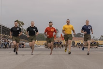 U.S. Marine Corps drill masters with Recruit Training Regiment lead a motivational run at Marine Corps Recruit Depot San Diego, California, May 9, 2024. The motivational run is the final training event new Marines complete before graduating which consists of a three-mile run throughout the Depot. (U.S. Marine Corps photo by Lance Cpl. Alexandra M. Earl)