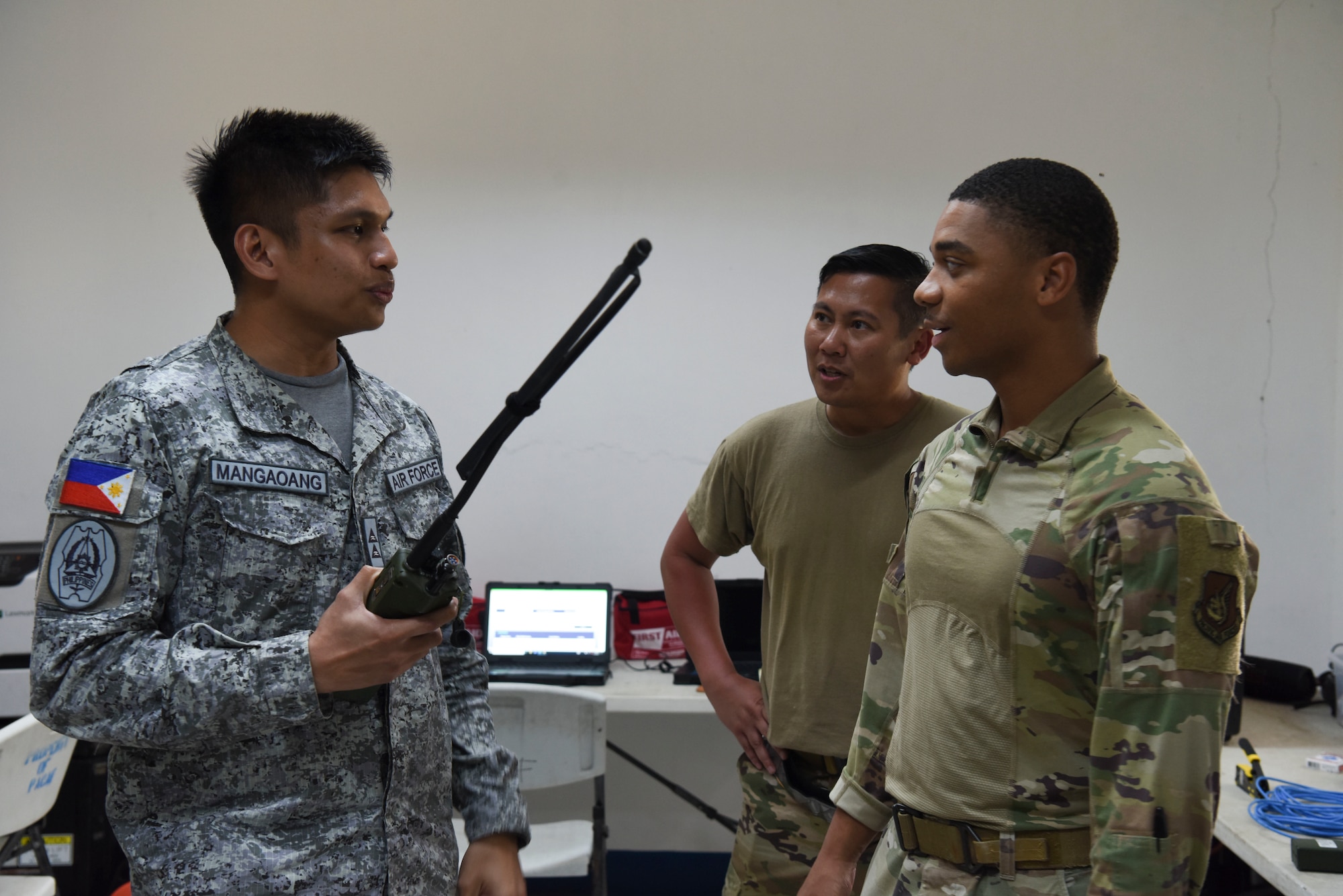 Photo of U.S. Air Force Airmen speaking with a Philippine Air Force officer