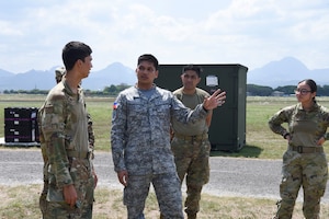 Photo of U.S. Air Force Airmen speaking with a Philippine Air Force officer