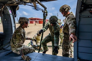 A Netherlands marine, assigned to the Marine Corps Squadron Caribbean, boards a UH-60 Black Hawk helicopter during a 7th Special Operation Group (Airborne) Soldier lead Fast Rope Insertion and Extraction System (FRIES) training at TRADEWINDS 24 (TW24) in Barbados, May 8, 2024.