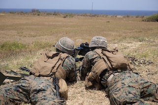 U.S. Marines with Alpha Company, 1st Battalion, 25th Marine Regiment, 4th Marine Division, fire an M240 L machine gun range during exercise TRADEWINDS 24 (TW24) at Paragon Army Base, Barbados, May 10, 2024.