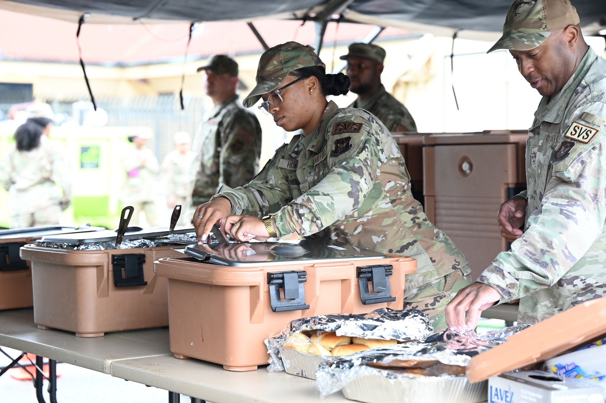 people inspect food before being served