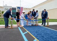 240514-N-MJ491-1048 VIRGINIA BEACH, Va. (May 14, 2024) Adm. Daryl Caudle, commander, U.S. Fleet Forces Command passes the side boys during a ribbon cutting ceremony for the Hefti Global Live, Virtual and Constructive (LVC) Operations Center at the Dam Neck Annex.  Hefti Global LVC Operations Center is named after Capt. John “Bag” Hefti, who was tragically killed in an auto accident in 2021.  Capt. Hefti led Sailors and operations in the Joint & Fleet Training Department for U.S. Fleet Forces.  Caudle officially named the Global LVC Operations Center after Capt. Hefti to honor his life and service. (U.S. Navy photo by Chief Mass Communication Specialist Matthew N. Jackson/Released)