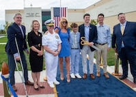 240514-N-MJ491-1048 VIRGINIA BEACH, Va. (May 14, 2024) Adm. Daryl Caudle, commander, U.S. Fleet Forces Command passes the side boys during a ribbon cutting ceremony for the Hefti Global Live, Virtual and Constructive (LVC) Operations Center at the Dam Neck Annex.  Hefti Global LVC Operations Center is named after Capt. John “Bag” Hefti, who was tragically killed in an auto accident in 2021.  Capt. Hefti led Sailors and operations in the Joint & Fleet Training Department for U.S. Fleet Forces.  Caudle officially named the Global LVC Operations Center after Capt. Hefti to honor his life and service. (U.S. Navy photo by Chief Mass Communication Specialist Matthew N. Jackson/Released)