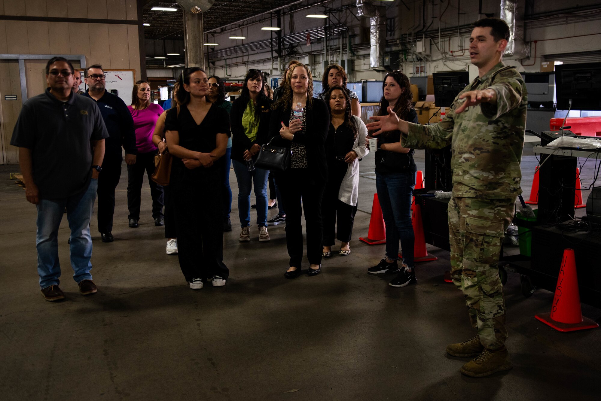 Officer gives tour to distinguished visitors.