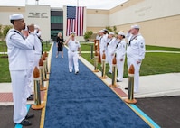 240514-N-MJ491-1048 VIRGINIA BEACH, Va. (May 14, 2024) Adm. Daryl Caudle, commander, U.S. Fleet Forces Command passes the side boys during a ribbon cutting ceremony for the Hefti Global Live, Virtual and Constructive (LVC) Operations Center at the Dam Neck Annex.  Hefti Global LVC Operations Center is named after Capt. John “Bag” Hefti, who was tragically killed in an auto accident in 2021.  Capt. Hefti led Sailors and operations in the Joint & Fleet Training Department for U.S. Fleet Forces.  Caudle officially named the Global LVC Operations Center after Capt. Hefti to honor his life and service. (U.S. Navy photo by Chief Mass Communication Specialist Matthew N. Jackson/Released)