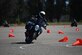 A motorcycle safety course participant maneuvers through cones during a motorcycle safety training course held at Vandenberg Space Force Base, Calif., May 11, 2024. The annual course, offered by the Space Launch Delta 30 Safety Office, aims to protect riders in visual awareness training and hands-on practice in handling advanced braking and corner maneuvers. (U.S. Space Force photo by Airman 1st Class Olga Houtsma)
