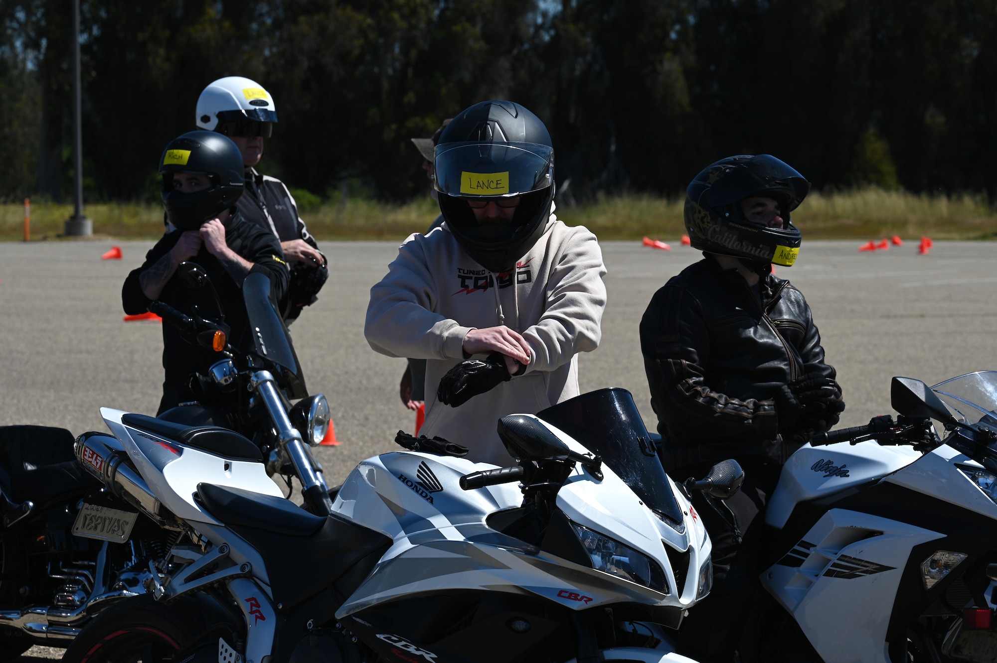 A person rides a motorcycle.