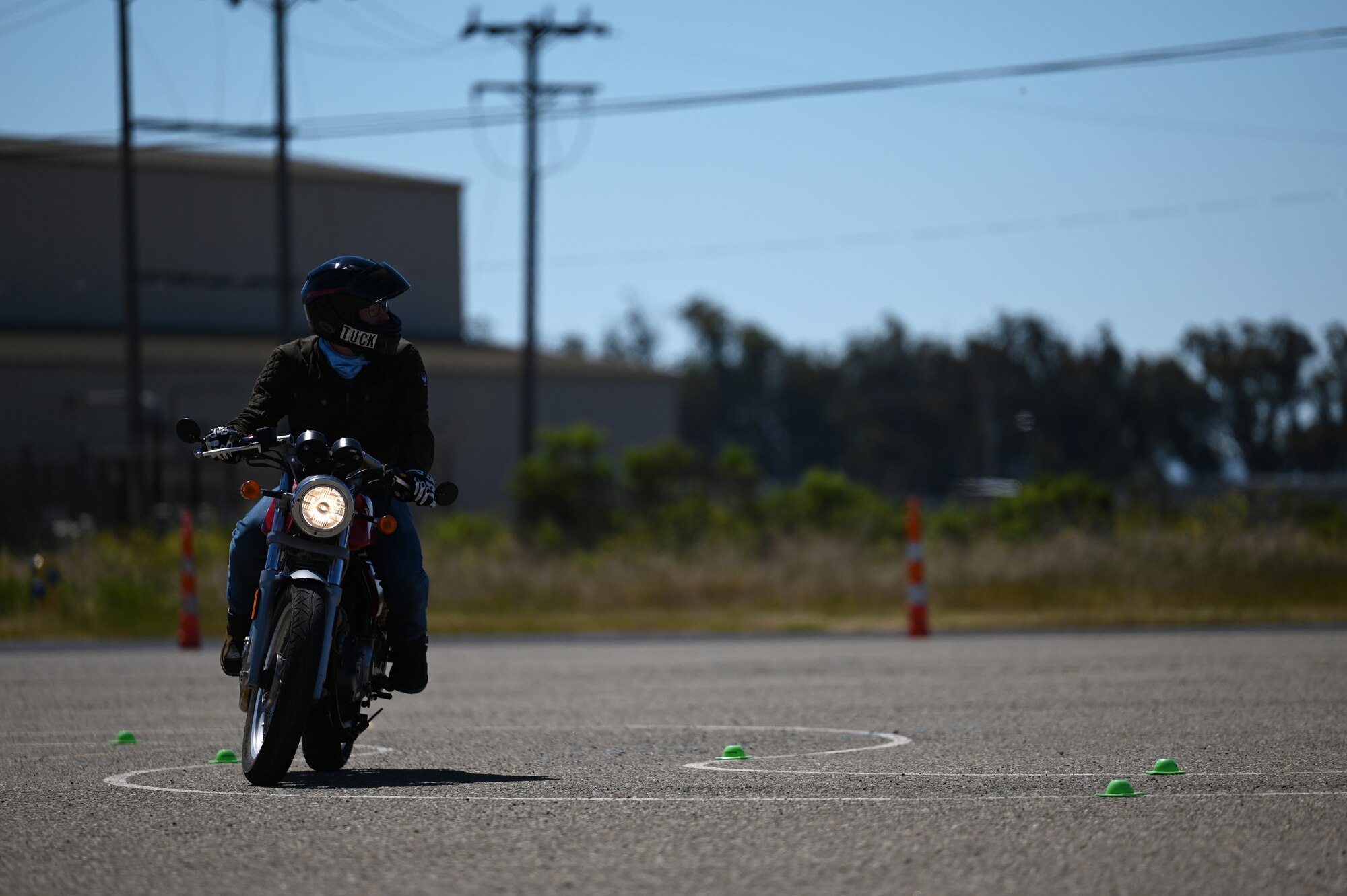 A person rides a motorcycle.
