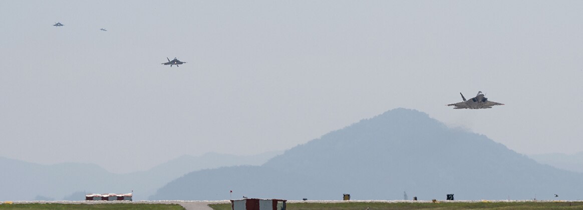 240513-F-SW533-1006 KUNSAN AIR BASE, South Korea (May 12, 2024) Four F-22 Raptor aircraft, assigned to the 19th and 199th Expeditionary Fighter Squadrons, Joint Base Pearl Harbor-Hickam, Hawaii, prepare to land at Kunsan Air Base, Republic of Korea, May 13, 2024. The aircrafts’ arrival showcases’ Kunsan Air Base’s ability to “Accept Follow-on Forces” and project 5th generation airpower within the region. (U.S. Air Force photo by Staff Sgt. Nicholas Ross)