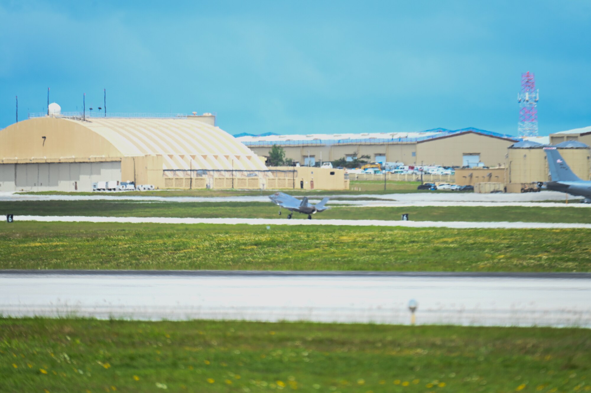 A U.S. Marine Corps F-35B Lightning II lands on a flightline.