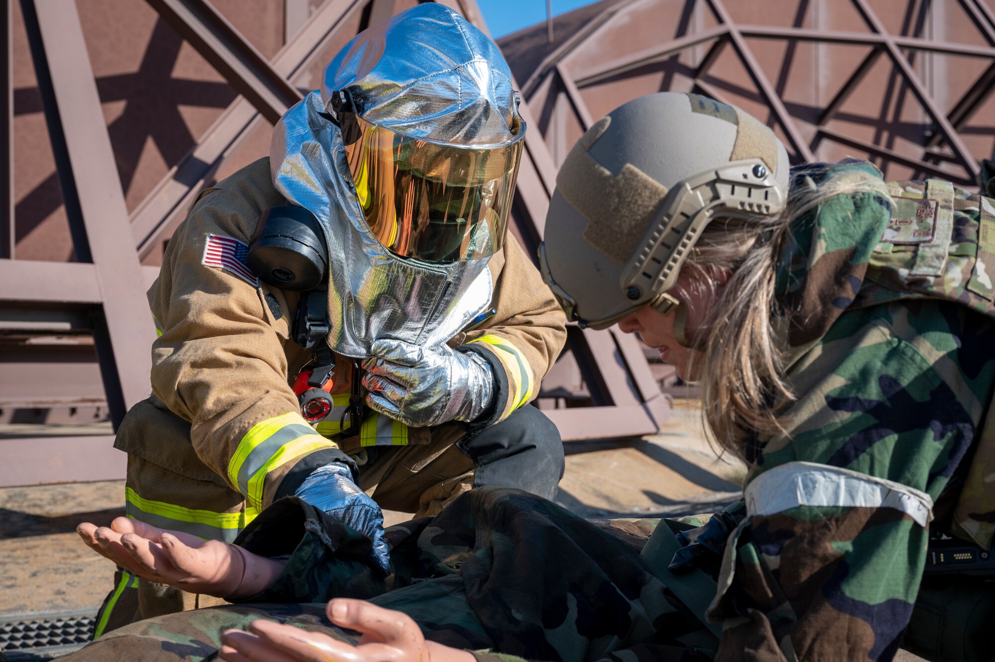 U.S. Air Force Maj. Lauren Foy, right, 51st Operational Medical Readiness Squadron flight medicine commander, and an Airman assigned to the 51st Civil Engineer Squadron assess a mannequin’s injuries during Beverly Herd 24-1 at Osan Air Base, Republic of Korea, May 13, 2024. The training during BH 24-1 provided 51st CES crew members the opportunity to apply knowledge and skills essential for contingency operations. Training is conducted throughout the year to generate combat airpower at a moment’s notice, affirming the commitment to the ROK remains ironclad and ensures regional stability throughout the U.S. Indo-Pacific Command. (U.S. Air Force photo by Senior Airman Sabrina Fuller-Judd)
