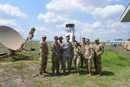 Photo of U.S. Air Force Airmen speaking with a Philippine Air Force officer