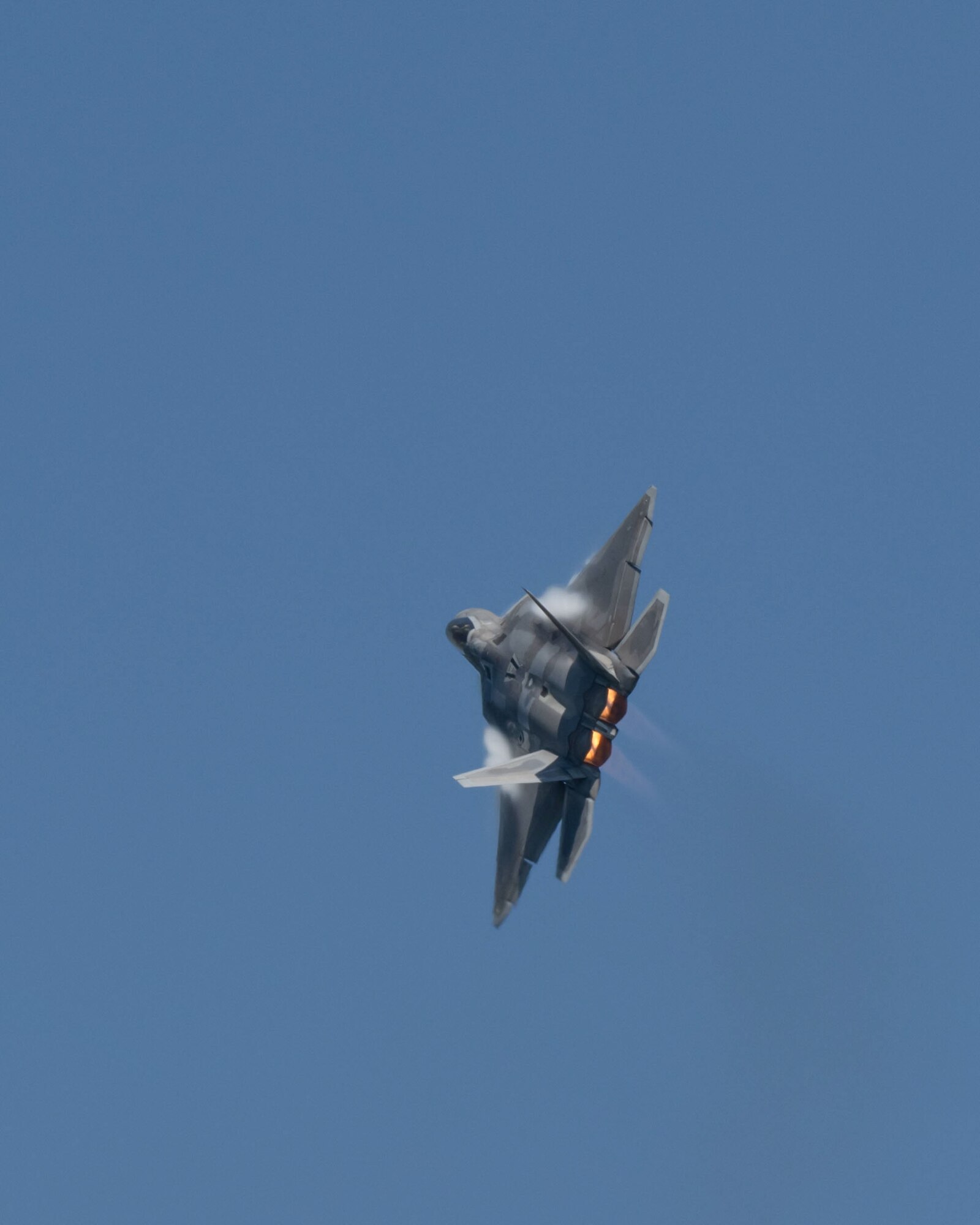 An F-22 Raptor, assigned to Joint Base Pearl Harbor-Hickam, flies over Kunsan Air Base.