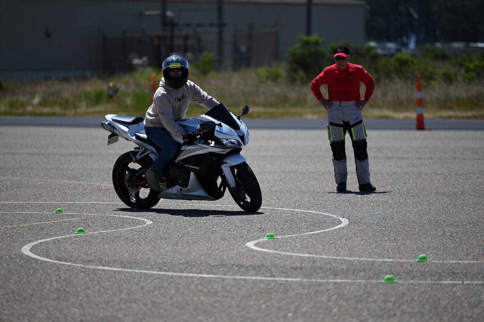 A person rides a motorcycle.
