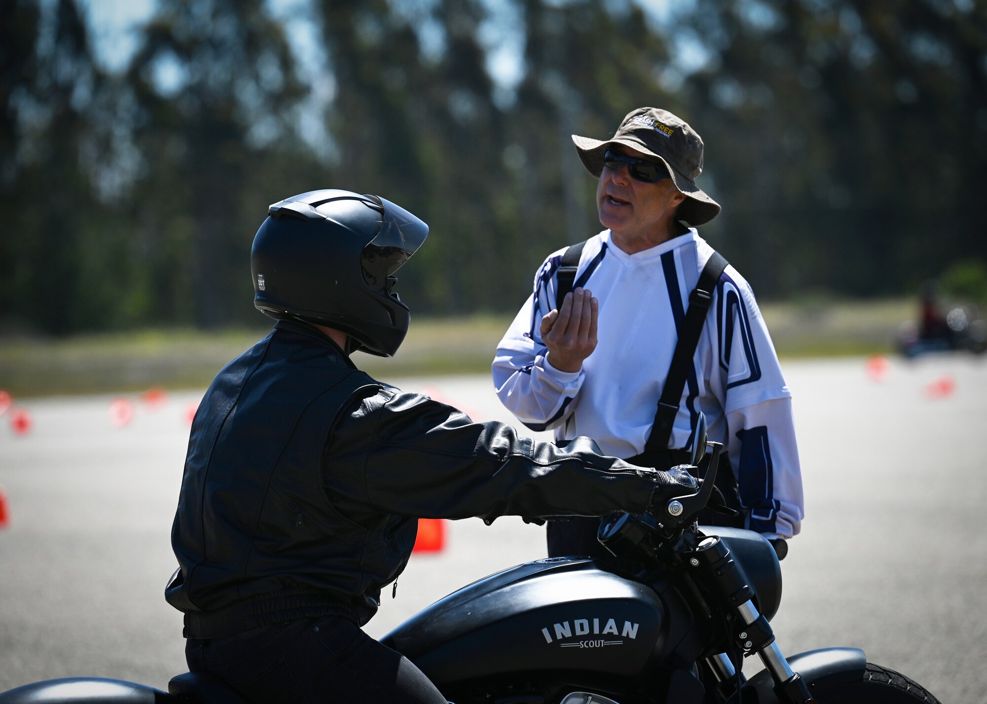 A person rides a motorcycle.