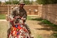 A U.S. Air Force Airman assigned to the 378th Air Expeditionary Wing rides a camel during a Saudi Arabian Culture Day at an undisclosed location within the U.S. Central Command area of responsibility, May 11, 2024. Culture Day provided valuable professional exchanges between Saudi citizens and Airmen. (U.S. Air Force photo)