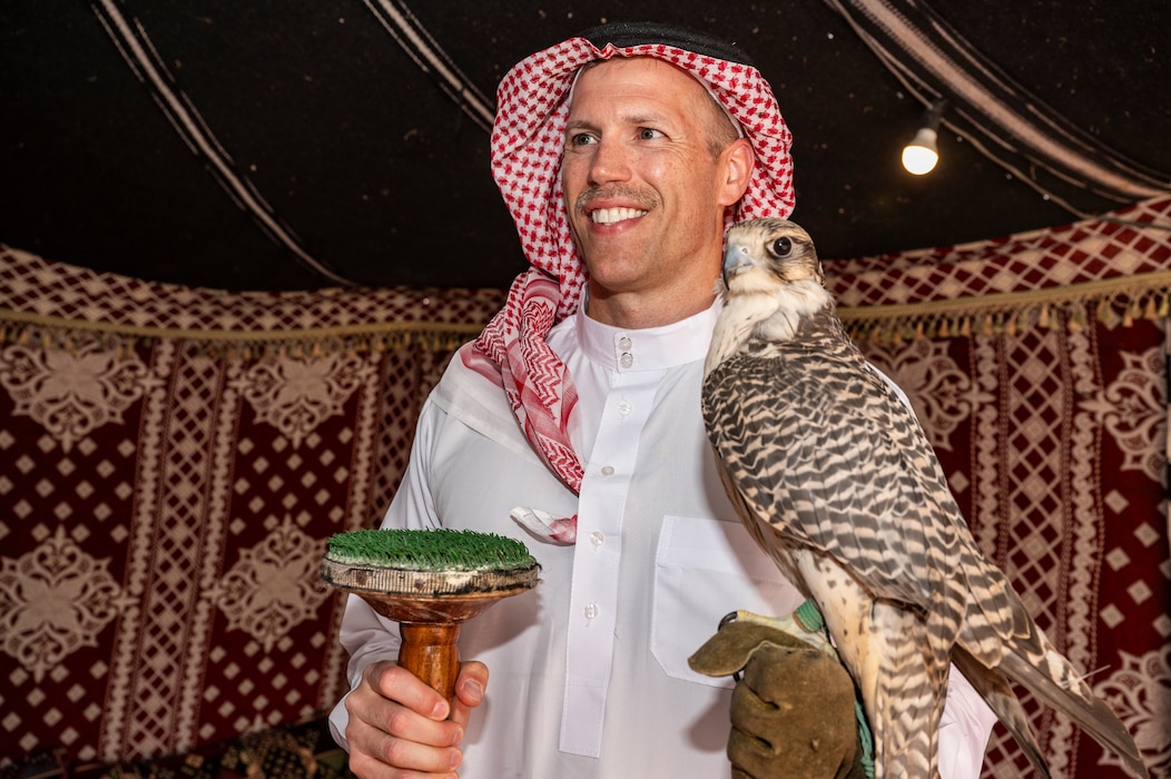 The U.S. Air Force 378th Expeditionary Air Base Group commander holds a falcon during a Saudi Arabian Culture Day at an undisclosed location within the U.S. Central Command area of responsibility, May 11, 2024. Culture Day provided valuable professional exchanges between Saudi citizens and Airmen. (U.S. Air Force photo)