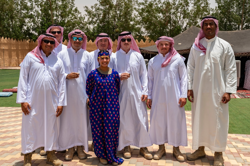 U.S. Air Force Airmen assigned to the 378th Air Expeditionary Wing pose for a group photo during a Saudi Arabian Culture Day at an undisclosed location within the U.S. Central Command area of responsibility, May 11, 2024. Airmen had the opportunity to wear traditional Saudi clothing while learning more about local customs and traditions. (U.S. Air Force photo)