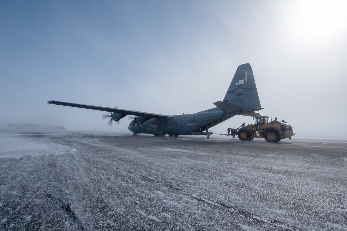 Airmen from the Kentucky Air National Guard’s 123rd Airlift Wing unload pallets of cargo under blizzard conditions during an engine-running offload from a Kentucky C-130J Super Hercules aircraft in Deadhorse, Alaska, on April 26, 2024. The cargo consists of construction materials to build homes for civilians as part of Innovative Readiness Training, a Defense Department program that provides service members with real-world deployment experience while offering lasting benefits to civilian populations. (U.S. Air National Guard photo by Phil Speck)