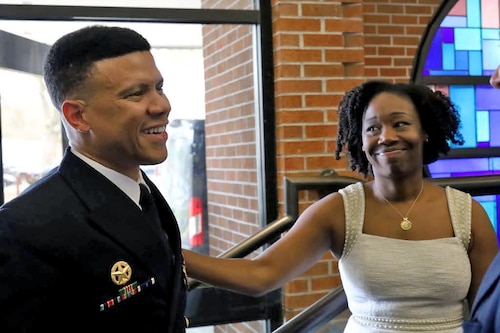 Commander and wife standing
