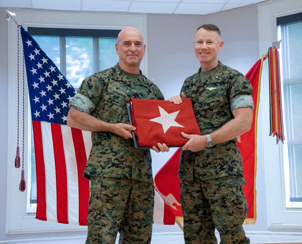 U.S. Marine Corps Brig. Gen. Samuel Meyer, right, shakes hands with Lt. Gen. David Ottignon, the commanding general of II Marine Expeditionary Force, during a frocking ceremony at Marine Corps Base Camp Lejeune, North Carolina, May 9, 2024. Frocking is a tradition where Marines are advanced to the next pay grade, assuming the title and the responsibilities prior to their official date of promotion. (U.S. Marine Corps photo by Cpl. Marc Imprevert)