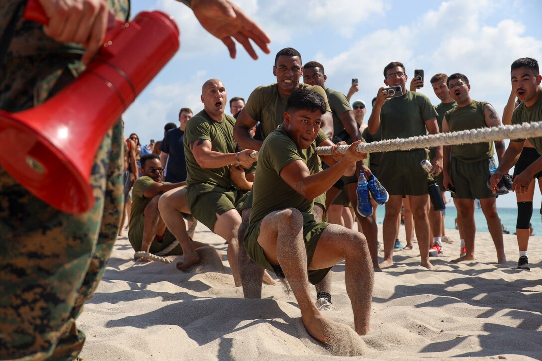 U.S. Marines compete in a tug-of-war contest at the Top Gun Beach Olympics event during Fleet Week Miami on May 11, 2024. Fleet Weeks are a tradition of the U.S. Navy, Marine Corps, and Coast Guard, where major U.S. cities host Marines, Sailors, and Coast Guardsmen for one week of community-wide events. Fleet Week Miami, in its first year, is an opportunity for residents and visitors to meet with service members, foster community relationships, and view the latest capabilities of today’s maritime services. (U.S. Marine Corps photo by Lance Cpl. Grace Stover)