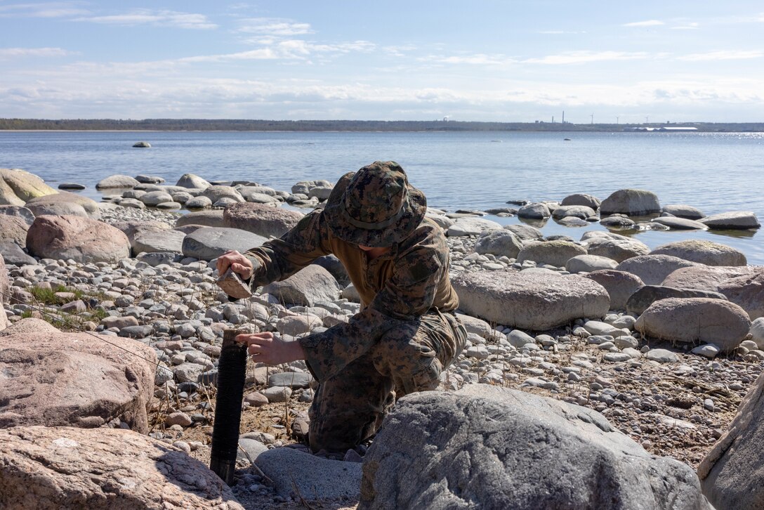 U.S. Marine Corps Lance Cpl. Brenden Allen, a Jackson, Tennessee native and an infantryman with Task Force 61/2.4 (Mobile Reconnaissance Company), begins to establish communications during exercise Spring Storm 24 in Letipea, Estonia, May 7, 2024. Spring Storm is an exercise in the Baltic Sea to enhance amphibious operations and staff interoperability between Estonian, Finish and U.S. naval forces. (U.S. Marine Corps Photo by Lance Cpl. Francis Hrosar)
