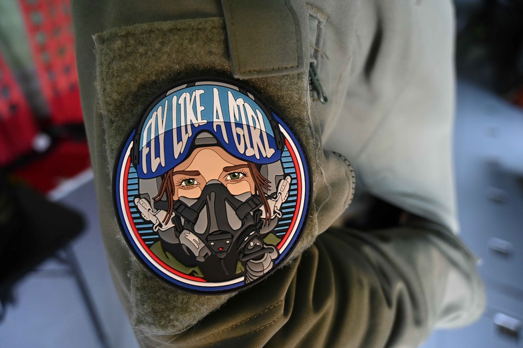 U.S. Air Force Master Sgt. Jenny Cook, 54th Air Refueling Squadron student training manager superintendent and KC-135 instructor boom operator, wears a “Fly Like a Girl” patch at the annual The Sky’s No Limit – She is Anything! event at the Abbotsford International Airport in British Columbia, Canada, April 27, 2024. The event aimed to inspire the next generation of female leaders in aviation and STEM. (U.S. Air Force photo by 1st Lt. Elisabeth Teitelman)