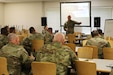 Col. Stuart James, the First Army Senior Regular Army Advisor to the Pennsylvania National Guard, provides instruction on engagement area development to Soldiers from Headquarters and Headquarters Co., 56th Stryker Brigade Combat Team May 14 at Fort Indiantown Gap. The 56th SBCT is currently preparing for a mobilization to the Joint Multinational Training Center to train the Armed Forces of Ukraine. (Pennsylvania National Guard photo by Maj. Cory M. Johnson)