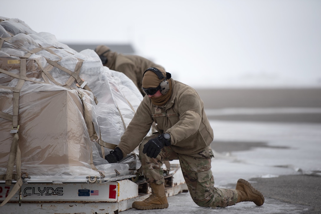 Airmen from the Kentucky Air National Guard’s 123rd Airlift Wing unload cargo from a Kentucky C-130J Super Hercules aircraft in Deadhorse, Alaska, on April 24, 2024. Airmen from the squadron also palletized the cargo, which consists of construction materials to build homes for civilians as part of Innovative Readiness Training, a Defense Department program that provides service members with real-world deployment experience while offering lasting benefits to civilian populations. (U.S. Air National Guard photo by Phil Speck)