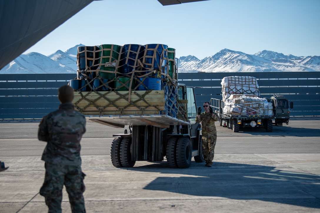 Airmen from the Kentucky Air National Guard’s 123rd Airlift Wing load cargo onto a Kentucky C-130J Super Hercules aircraft prior to departure from Joint Base Elmendorf-Richardson, Alaska, on April 24, 2024. The air transportation specialists, all from the wing’s 123rd Logistics Readiness Squadron, also palletized the cargo, which consists of building materials being shipped to Alaska’s North Slope. The items will be used to build homes for civilians as part of Innovative Readiness Training, a Defense Department program that provides service members with real-world deployment experience while offering lasting benefits to civilian populations. (U.S. Air National Guard photo by Phil Speck)