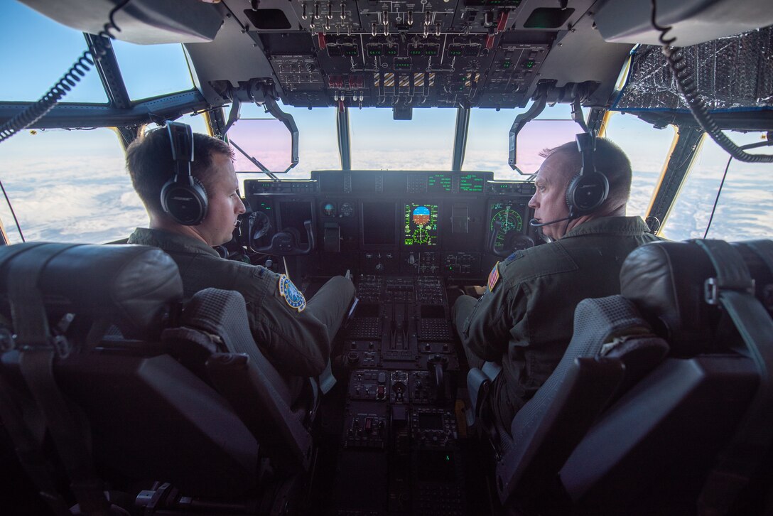 1st Lt. Aaron Johnson, left, and Lt. Col. Jason Craig, both pilots with the Kentucky Air National Guard’s 165th Airlift Squadron, fly a Kentucky C-130J Super Hercules aircraft over Alaska on April 26, 2024. The crew is airlifting construction supplies to Alaska’s North Slope, where they will be used to build homes for civilians as part of Innovative Readiness Training, a Defense Department program that provides service members with real-world deployment experience while offering lasting benefits to civilian populations. (U.S. Air National Guard photo by Phil Speck)