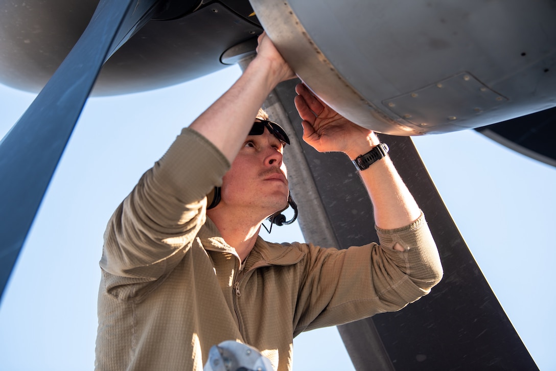 Tech. Sgt. Parker Nesbit, a crew chief with the Kentucky Air National Guard’s 123rd Aircraft Maintenance Squadron, inspects the engine of a Kentucky C-130J Super Hercules aircraft prior to departure from Joint Base Elmendorf-Richardson, Alaska, on April 24, 2024. The aircraft was being used to airlift construction materials to the Alaska’s North Slope, where they will be employed to build homes for civilians as part of Innovative Readiness Training, a Defense Department program that provides service members with real-world deployment experience while offering lasting benefits to civilian populations. (U.S. Air National Guard photo by Phil Speck)